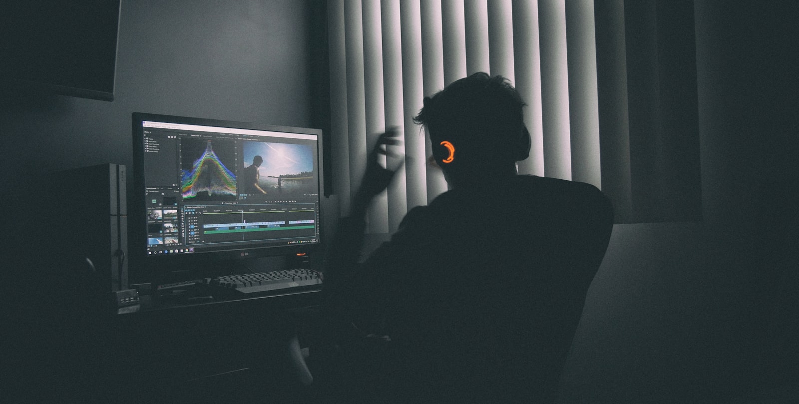 Designer choosing bold fonts for a YouTube thumbnail on a computer